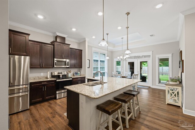 5622 Dunridge Dr, Pace, FL 32571 - kitchen with appliances with stainless steel finishes, dark wood-style flooring, dark brown cabinetry, plenty of natural light, and recessed lighting