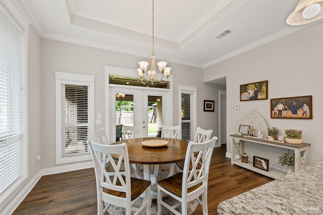 5622 Dunridge Dr, Pace, FL 32571 - dining space with french doors, dark wood-type flooring, a chandelier, a tray ceiling, and ornamental molding