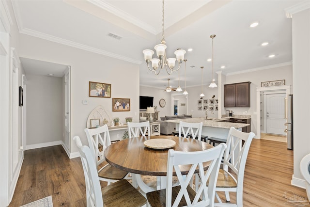 5622 Dunridge Dr, Pace, FL 32571 - dining room featuring recessed lighting, light wood-type flooring, a chandelier, crown molding, and a ceiling fan