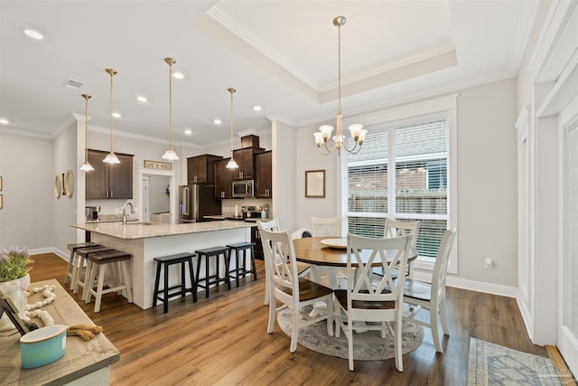 5622 Dunridge Dr, Pace, FL 32571 - dining room featuring wood finished floors, a chandelier, recessed lighting, and crown molding