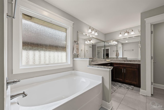 5622 Dunridge Dr, Pace, FL 32571 - full bath with vanity, a garden tub, and tile patterned flooring