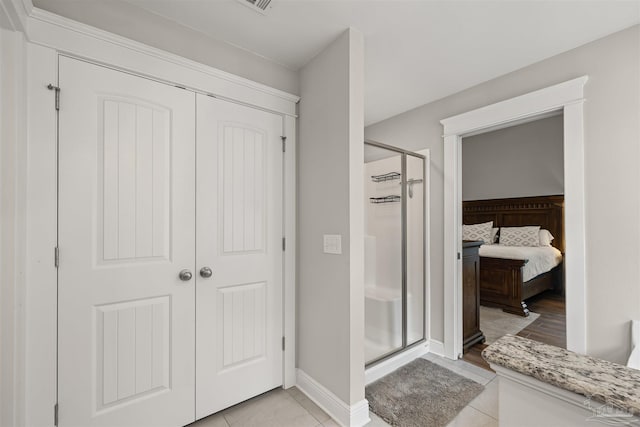 5622 Dunridge Dr, Pace, FL 32571 - ensuite bathroom with a shower stall and tile patterned flooring