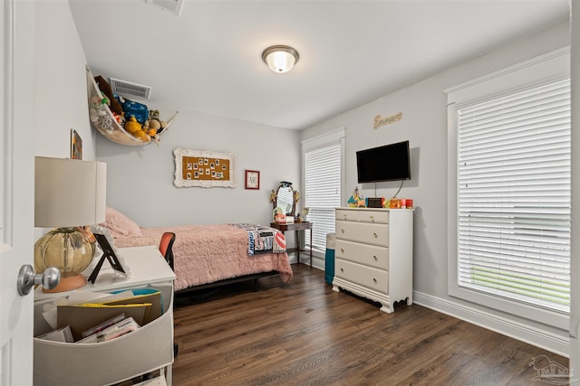 5622 Dunridge Dr, Pace, FL 32571 - bedroom with dark wood-type flooring and baseboards