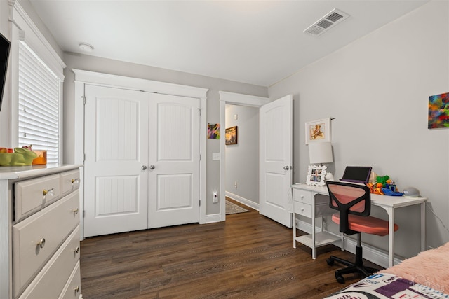 5622 Dunridge Dr, Pace, FL 32571 - bedroom featuring dark wood-type flooring and a closet
