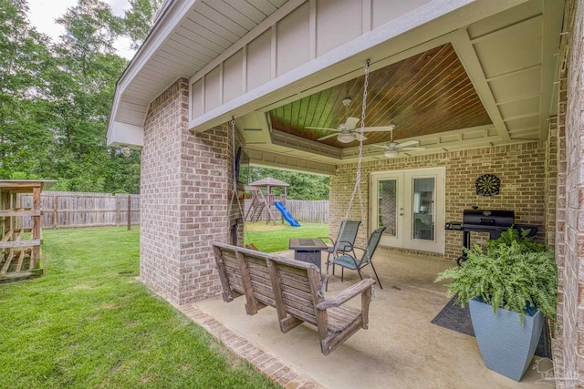 5622 Dunridge Dr, Pace, FL 32571 - fenced backyard featuring a playground, grilling area, ceiling fan, and a patio area