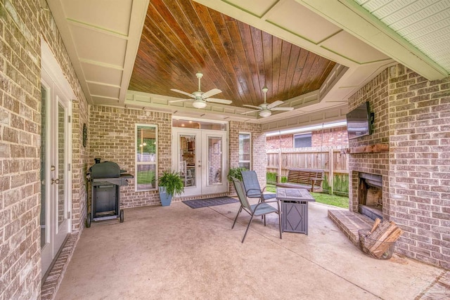 5622 Dunridge Dr, Pace, FL 32571 - view of patio / terrace featuring french doors, an outdoor brick fireplace, a grill, and a ceiling fan