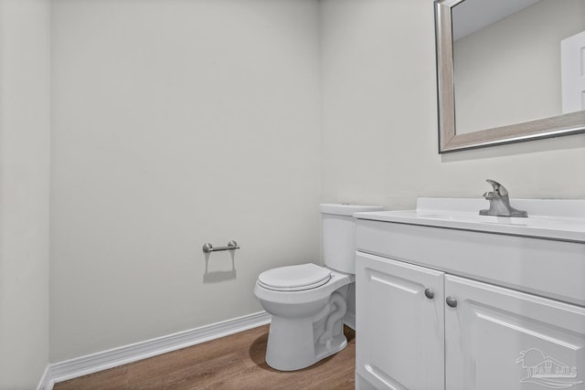 3514 Silvertree Ln, Pensacola, FL 32504 - bathroom with wood finished floors, vanity, toilet, and baseboards