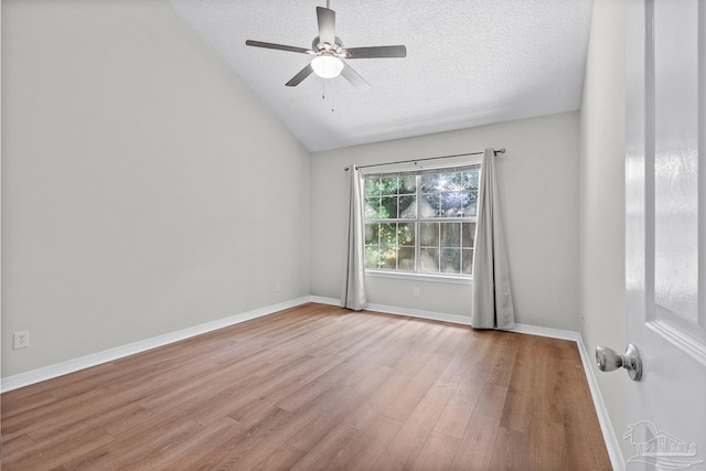 3514 Silvertree Ln, Pensacola, FL 32504 - empty room featuring wood finished floors, vaulted ceiling, ceiling fan, a textured ceiling, and baseboards