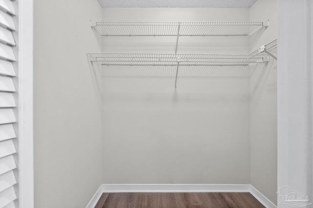 3514 Silvertree Ln, Pensacola, FL 32504 - walk in closet featuring dark wood finished floors