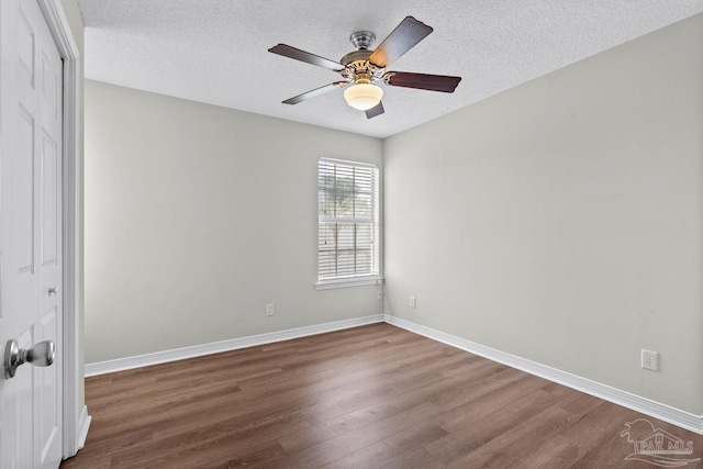 3514 Silvertree Ln, Pensacola, FL 32504 - unfurnished room with wood finished floors, baseboards, ceiling fan, and a textured ceiling