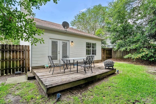 3514 Silvertree Ln, Pensacola, FL 32504 - wooden deck with french doors, an outdoor fire pit, and outdoor dining space