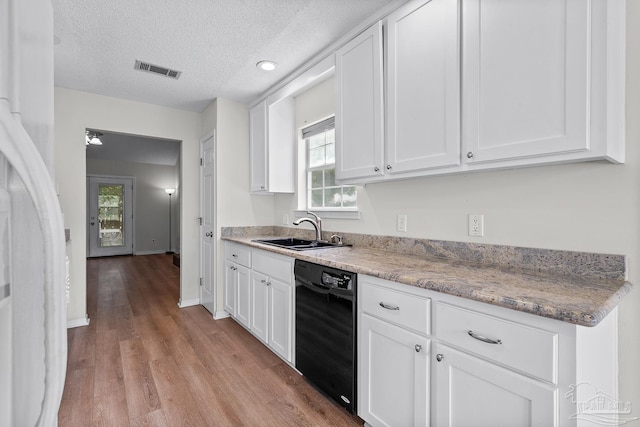 3514 Silvertree Ln, Pensacola, FL 32504 - kitchen with dishwasher, a sink, light wood-type flooring, white cabinets, and a textured ceiling
