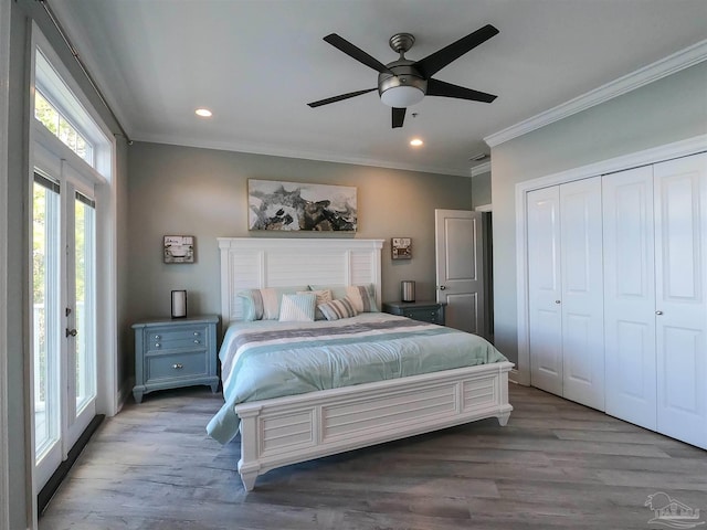 bedroom featuring hardwood / wood-style flooring, a closet, access to outside, ceiling fan, and crown molding