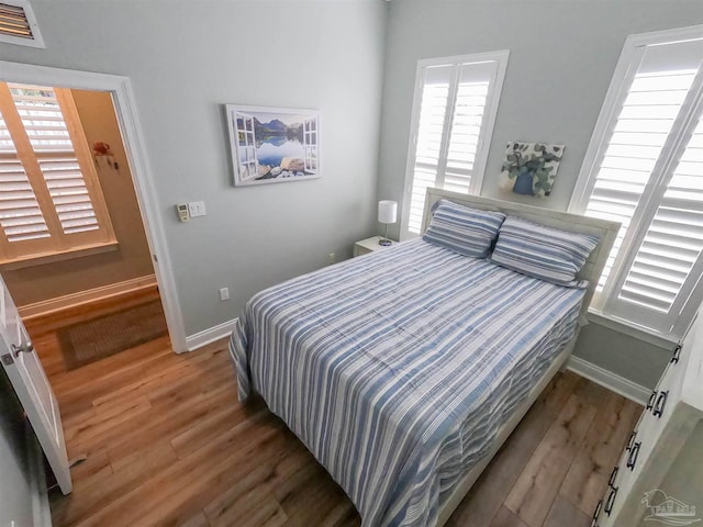 bedroom featuring wood-type flooring