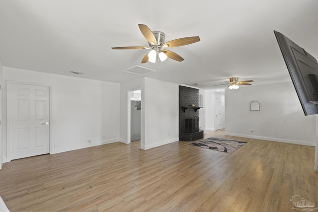 4224 Seaport Rd, Pace, FL 32571 - unfurnished living room featuring ceiling fan, light wood-style flooring, baseboards, and a brick fireplace