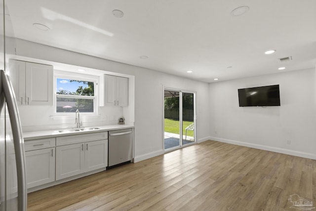 4224 Seaport Rd, Pace, FL 32571 - kitchen with appliances with stainless steel finishes, a sink, light wood-type flooring, baseboards, and recessed lighting