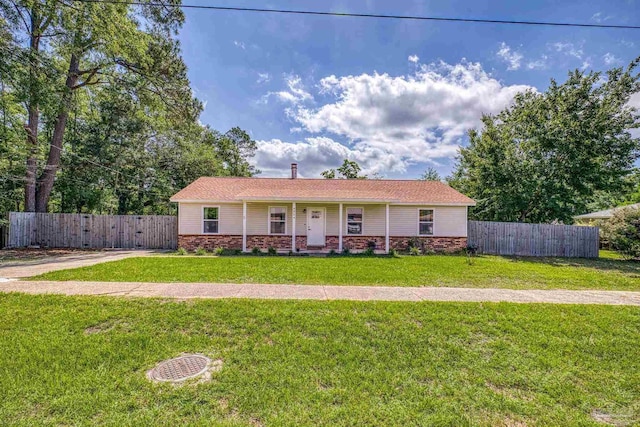 4224 Seaport Rd, Pace, FL 32571 - ranch-style house with covered porch and a gate