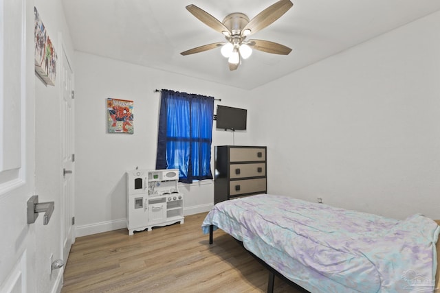 4224 Seaport Rd, Pace, FL 32571 - bedroom featuring wood finished floors, baseboards, and a ceiling fan