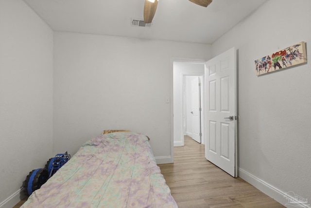 4224 Seaport Rd, Pace, FL 32571 - bedroom featuring baseboards, light wood-type flooring, and ceiling fan