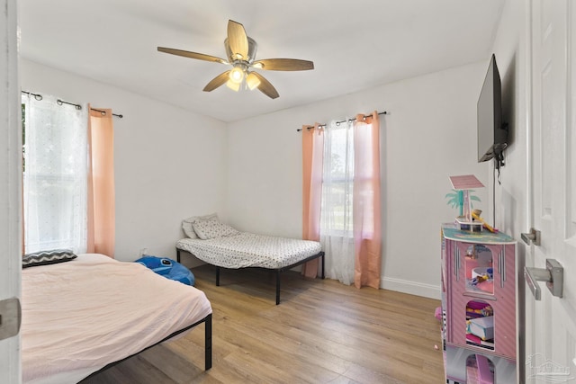 4224 Seaport Rd, Pace, FL 32571 - bedroom featuring wood finished floors, baseboards, and ceiling fan