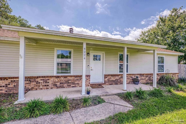 4224 Seaport Rd, Pace, FL 32571 - view of front of home with a porch and brick siding
