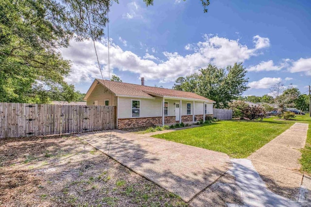 4224 Seaport Rd, Pace, FL 32571 - ranch-style home with brick siding and a gate