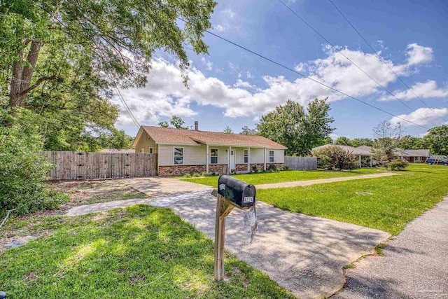4224 Seaport Rd, Pace, FL 32571 - single story home with driveway, a gate, and stone siding