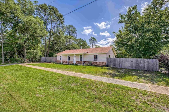 4224 Seaport Rd, Pace, FL 32571 - ranch-style home featuring stone siding and a porch