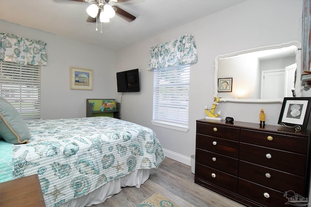 bedroom featuring light hardwood / wood-style floors and ceiling fan