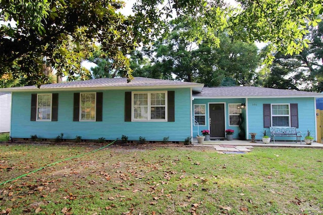 ranch-style house with a front lawn