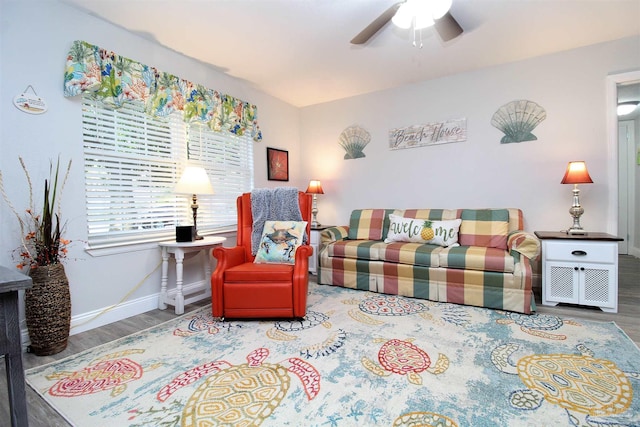 living room with hardwood / wood-style floors and ceiling fan