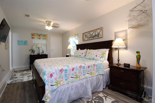 bedroom with a closet, ceiling fan, and dark hardwood / wood-style flooring