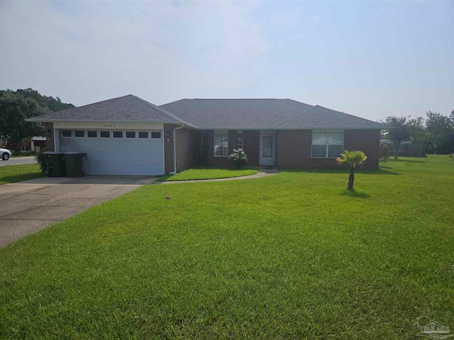 ranch-style home with a garage and a front lawn