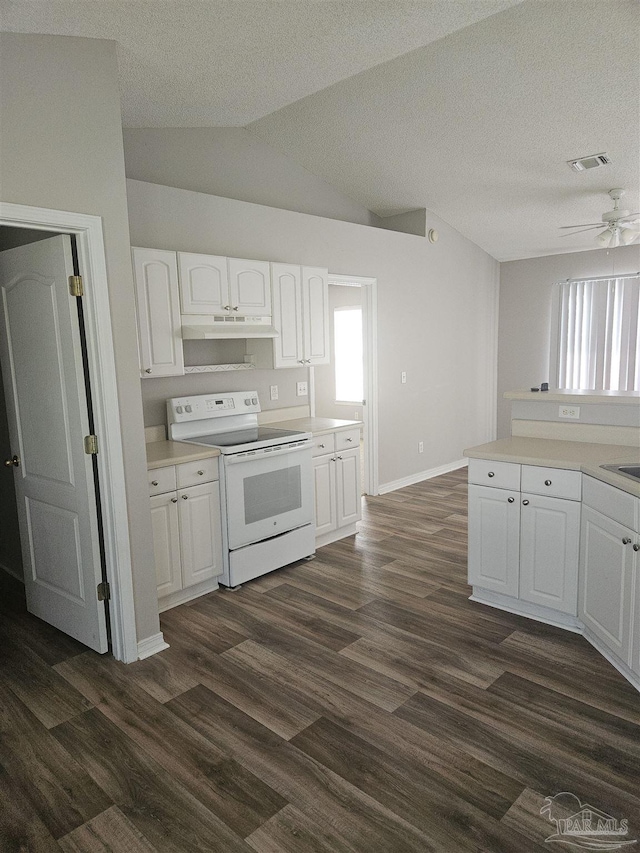 kitchen with under cabinet range hood, white electric stove, white cabinets, and light countertops