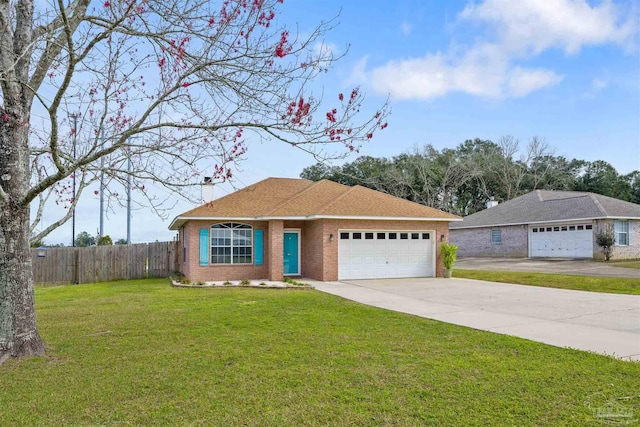 ranch-style home featuring a garage and a front lawn