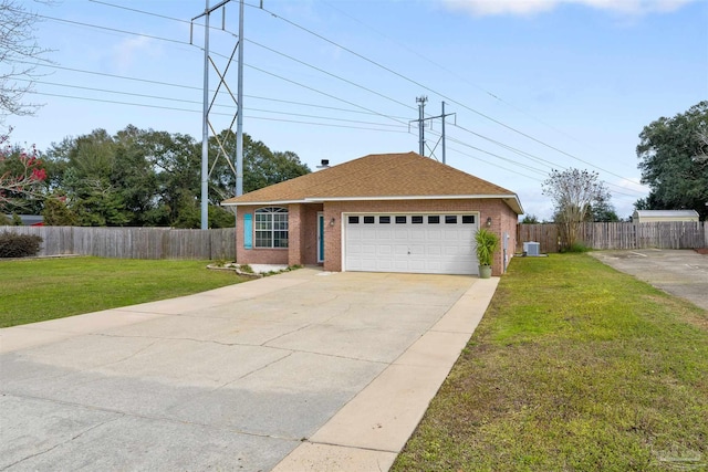 ranch-style home featuring a garage, central air condition unit, and a front lawn