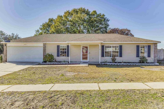 single story home featuring a front lawn and a garage