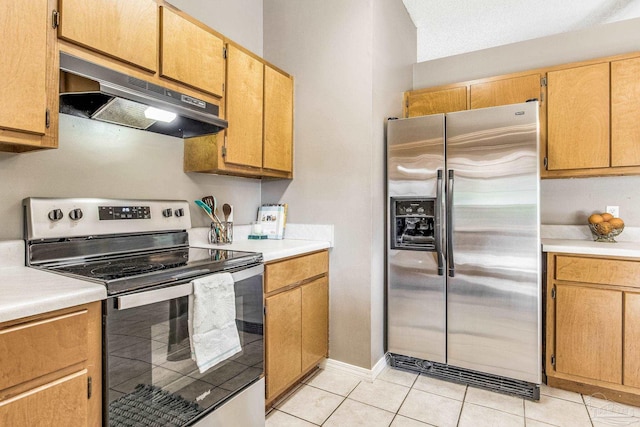 kitchen featuring light tile patterned floors and appliances with stainless steel finishes