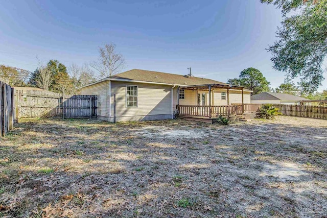 rear view of property with a deck