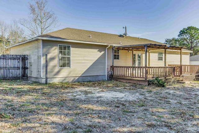 rear view of property with a wooden deck