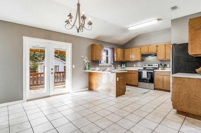 kitchen with pendant lighting, lofted ceiling, stainless steel range with electric cooktop, french doors, and light tile patterned floors