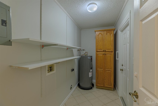 laundry area with cabinets, electric water heater, electric panel, light tile patterned floors, and a textured ceiling