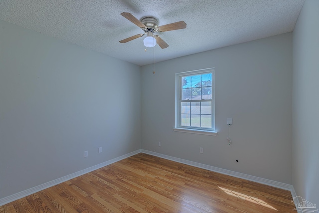 4679 E Spencer Field Rd, Pace, FL 32571 - spare room featuring a textured ceiling, ceiling fan, light wood-type flooring, and baseboards
