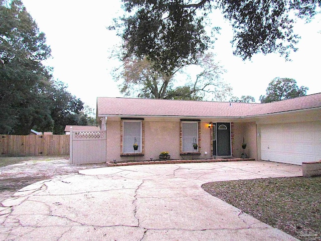 4679 E Spencer Field Rd, Pace, FL 32571 - ranch-style home with fence, driveway, and an attached garage