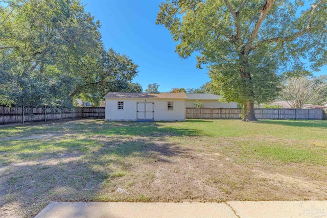 4679 E Spencer Field Rd, Pace, FL 32571 - view of yard with a fenced backyard and an outbuilding