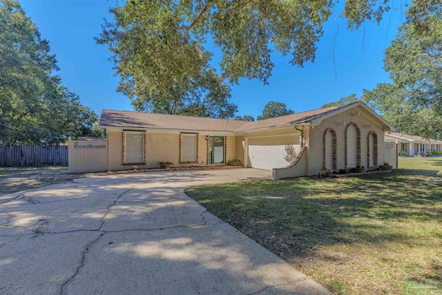 view of front of property featuring a garage and a front yard