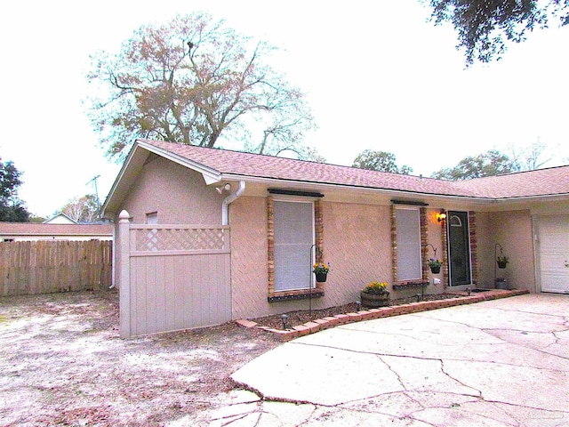 4679 E Spencer Field Rd, Pace, FL 32571 - view of front of home with stucco siding and fence