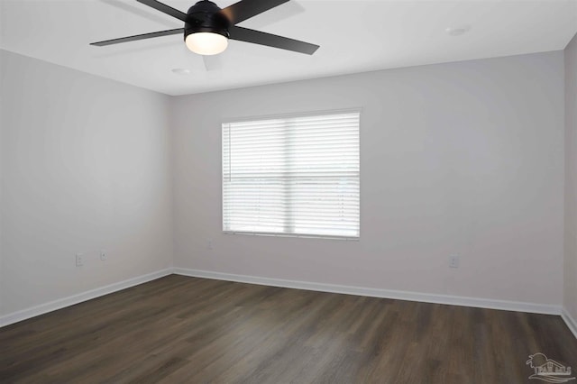 unfurnished room with dark wood-type flooring and ceiling fan