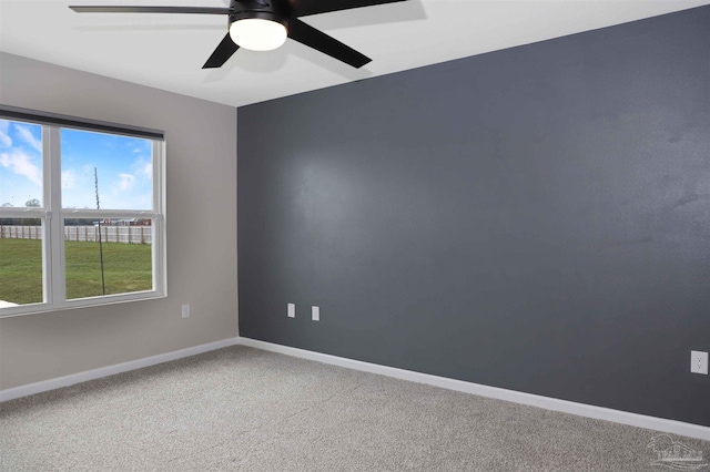 empty room featuring ceiling fan and carpet flooring