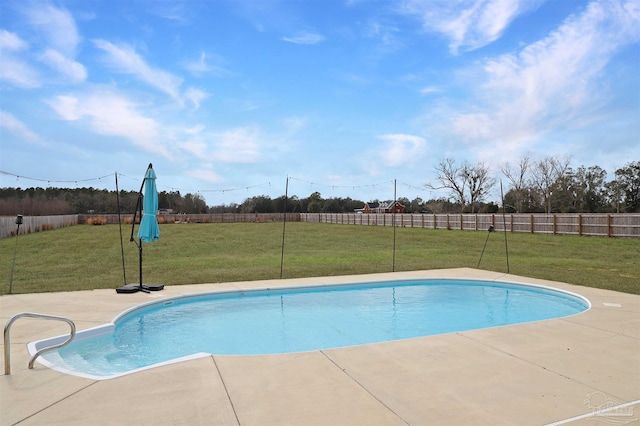 view of pool featuring a yard and a patio